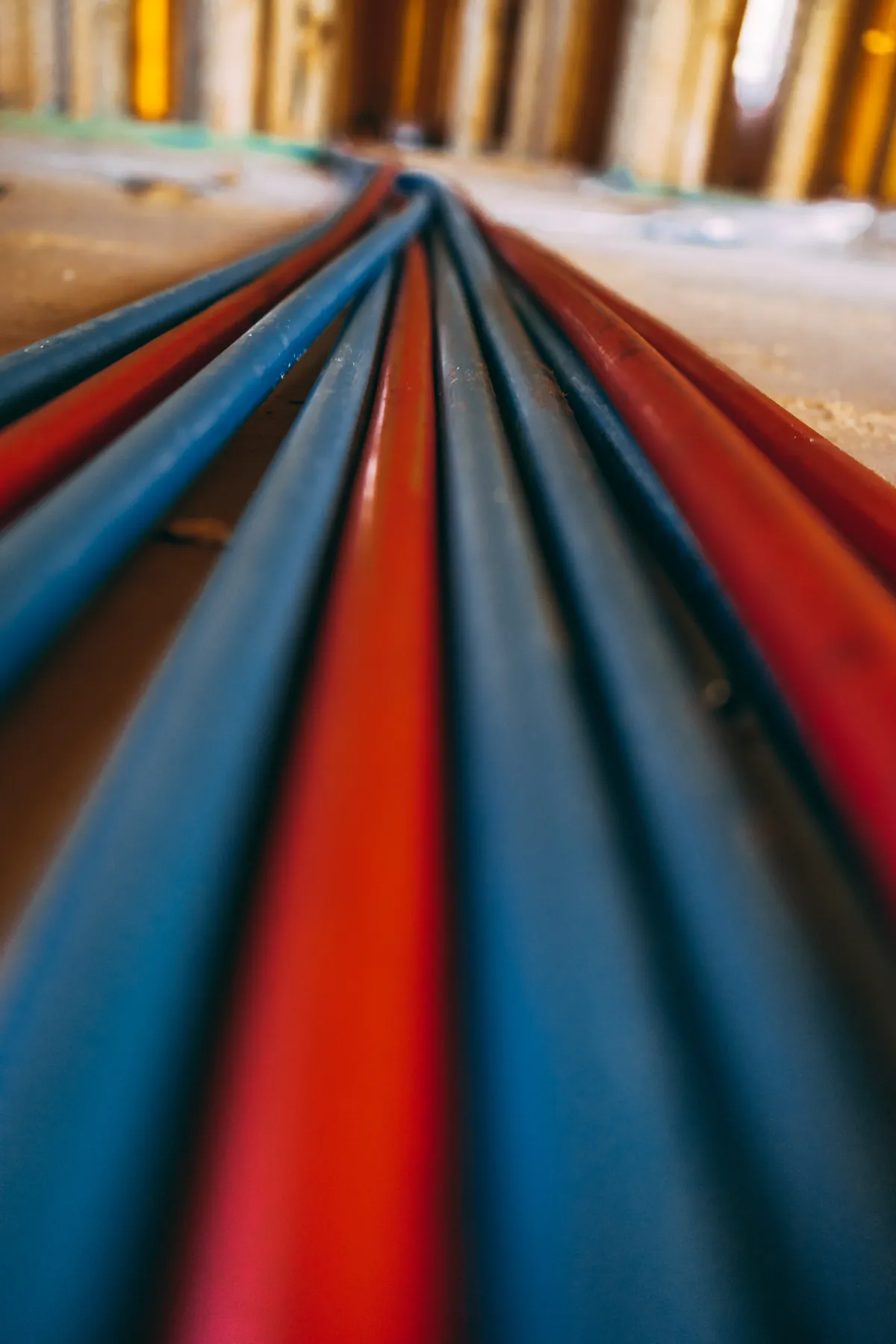 Coiled red and blue PEX tubing ready for a repipe, from our Trabuco Canyon guide: Main Water Line Replacement